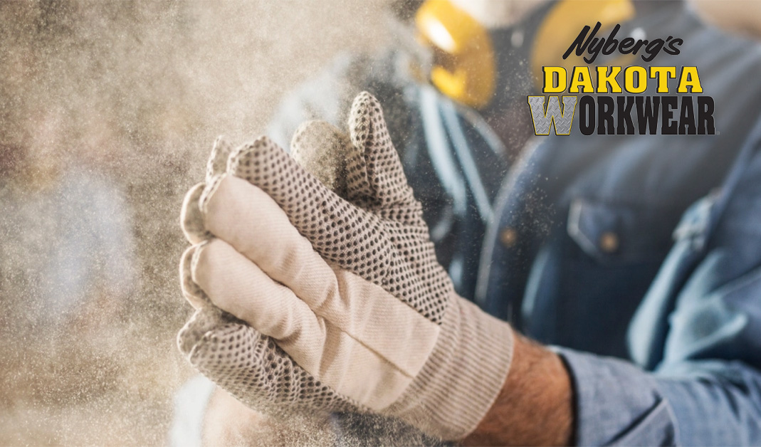 Man working with Dakota Workwear gloves on